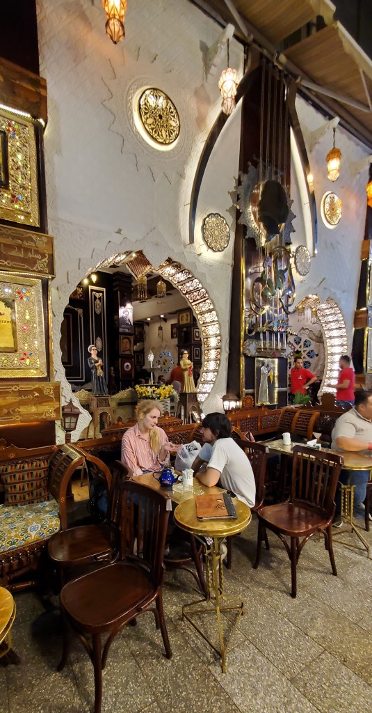 Guests enjoying a meal at a cafe at Khan el-Khalili, Cairo